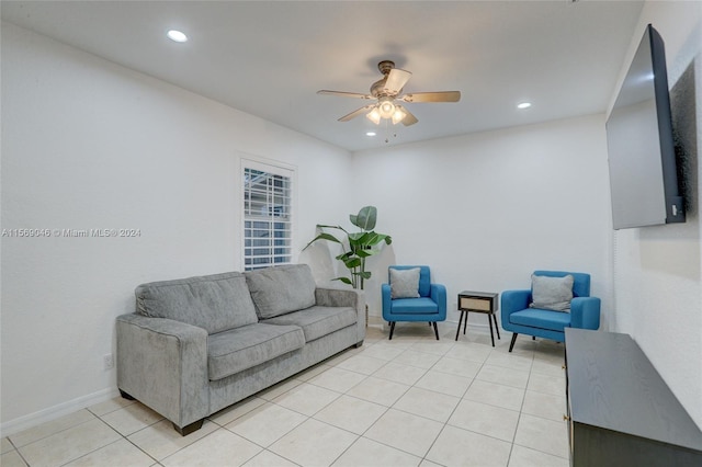 living room featuring light tile patterned floors and ceiling fan