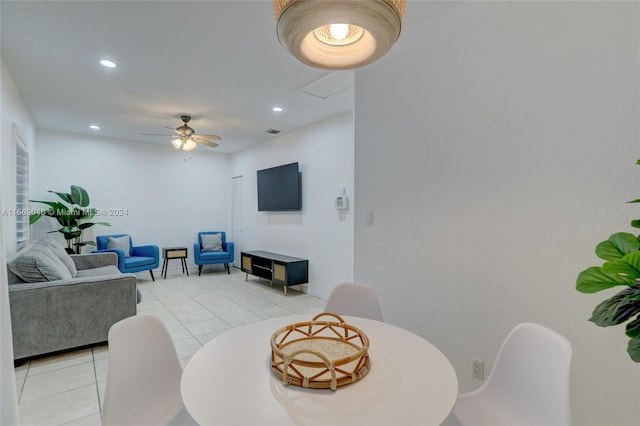 tiled living room with ceiling fan