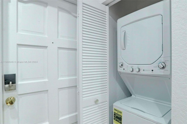 laundry room featuring stacked washer / dryer