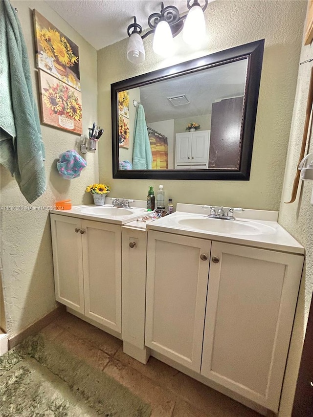 bathroom with dual bowl vanity