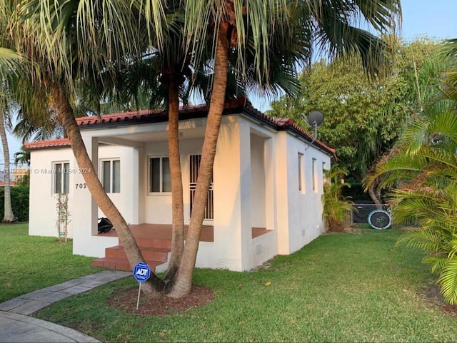 view of outdoor structure with a lawn