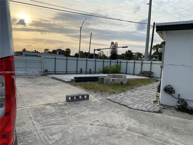 view of patio terrace at dusk