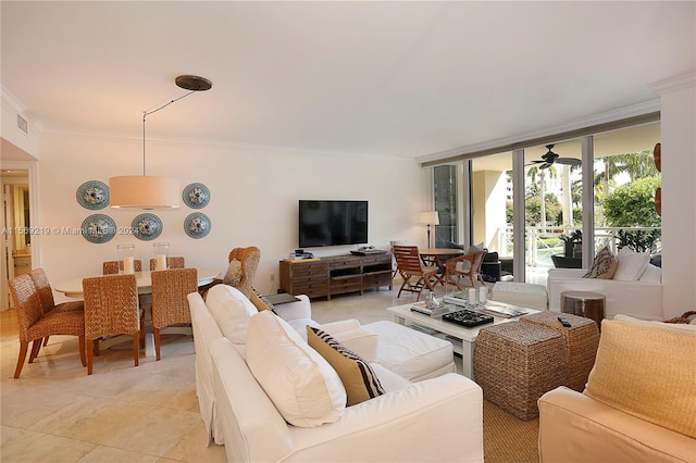 living room featuring ceiling fan, crown molding, and light tile floors