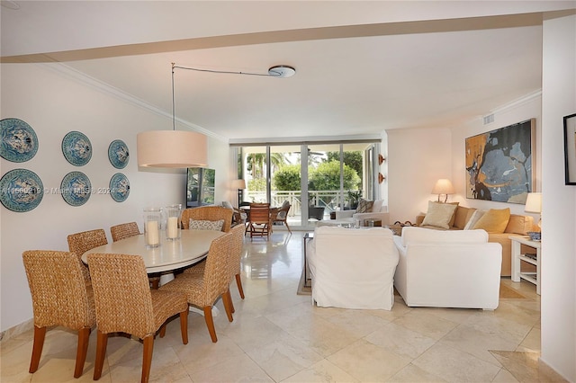 dining space featuring floor to ceiling windows, crown molding, and light tile floors