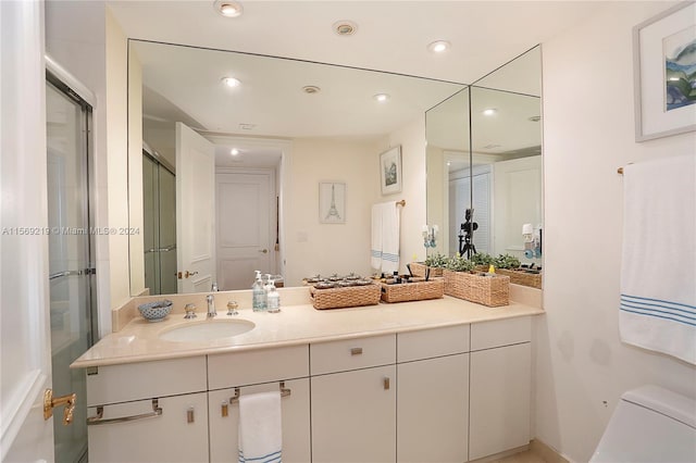 bathroom with toilet and vanity