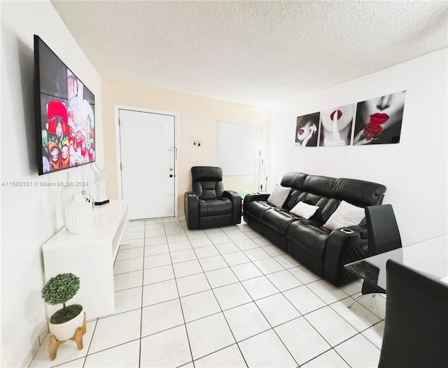 tiled living room with a textured ceiling