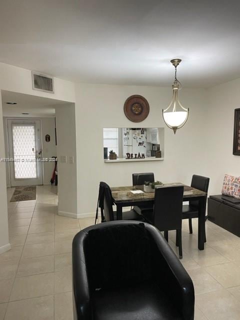 dining area with light tile floors