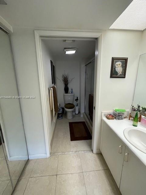 bathroom featuring tile floors and vanity