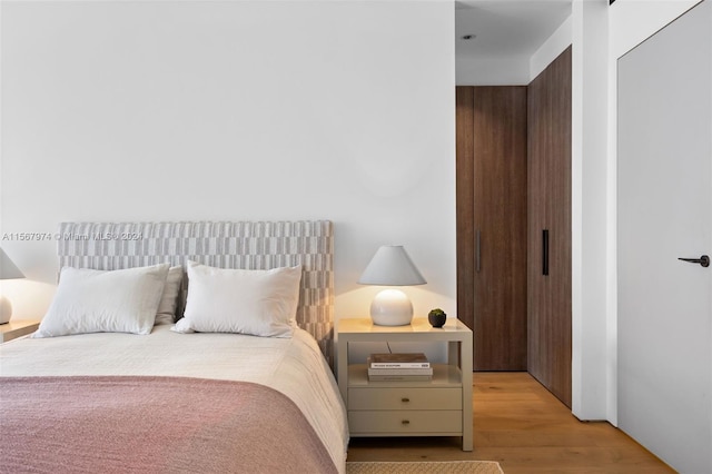 bedroom featuring light wood-type flooring