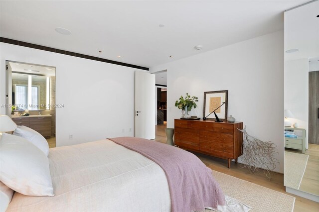 bedroom with light hardwood / wood-style flooring