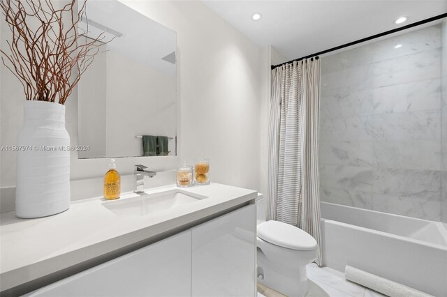 full bathroom with vanity, toilet, and shower / tub combo