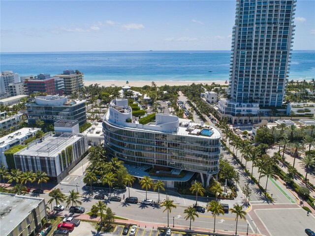 aerial view with a beach view and a water view