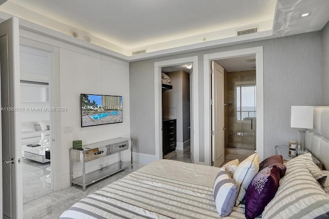 tiled bedroom featuring connected bathroom