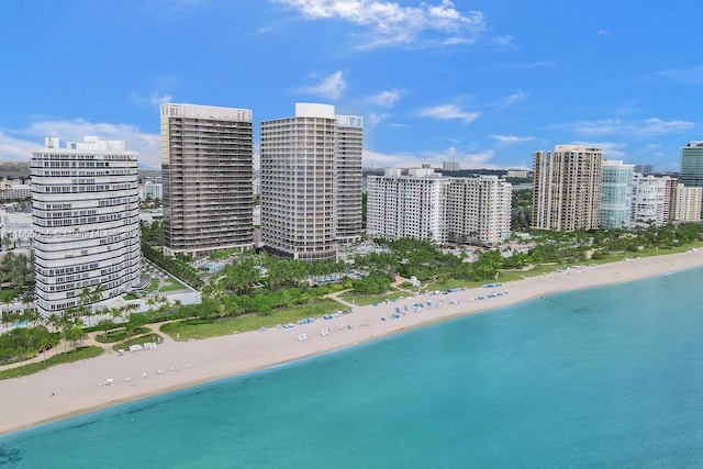 birds eye view of property with a view of the beach and a water view