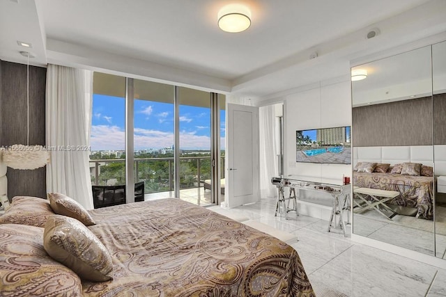 bedroom featuring a wall of windows, access to outside, and light tile floors