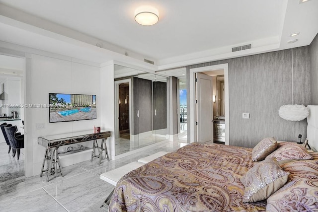 bedroom featuring light tile floors