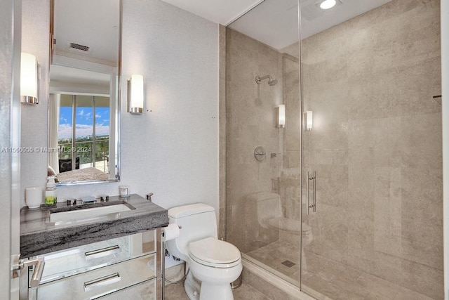 bathroom with tile flooring, walk in shower, vanity, and toilet