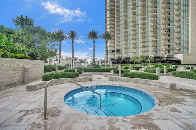 view of pool featuring a hot tub