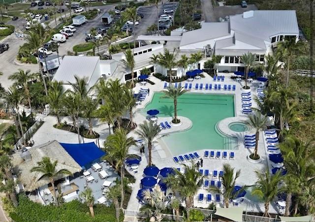 bird's eye view with a water view and a view of the beach