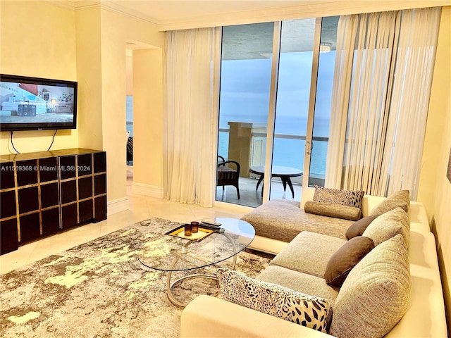 tiled living room featuring ornamental molding and a water view