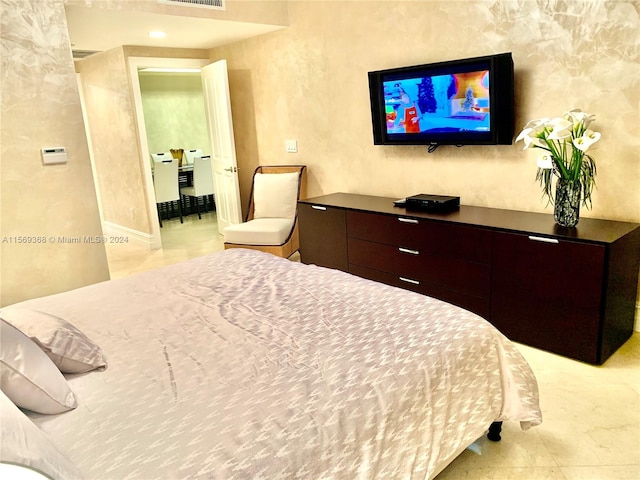 bedroom featuring light tile floors