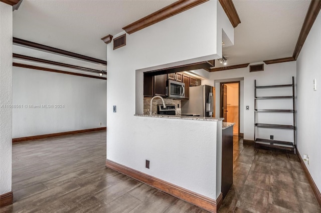 kitchen featuring crown molding, decorative backsplash, dark hardwood / wood-style floors, appliances with stainless steel finishes, and kitchen peninsula