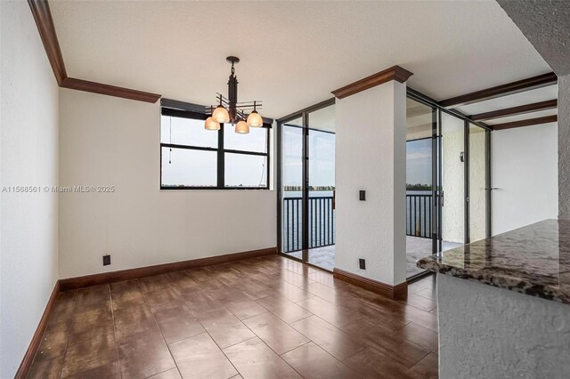 kitchen featuring decorative backsplash, light stone countertops, track lighting, stainless steel appliances, and sink