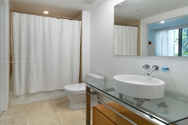 full bathroom with toilet, tile floors, shower / bath combination with curtain, and large vanity