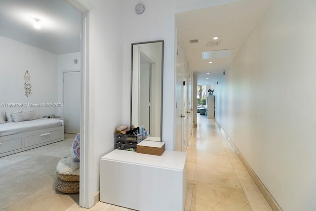 hallway with light tile floors