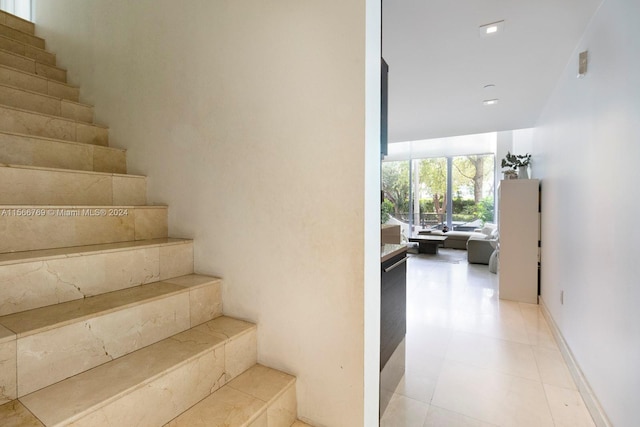 staircase with light tile flooring