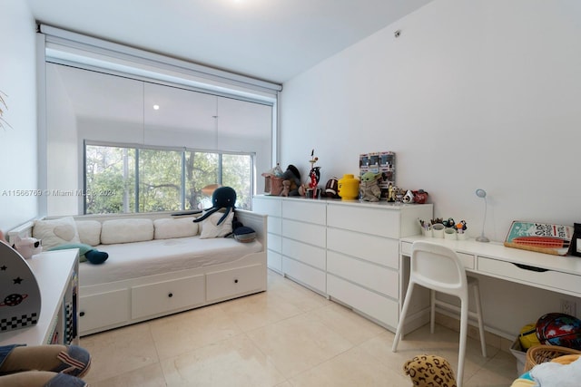 bedroom featuring light tile floors