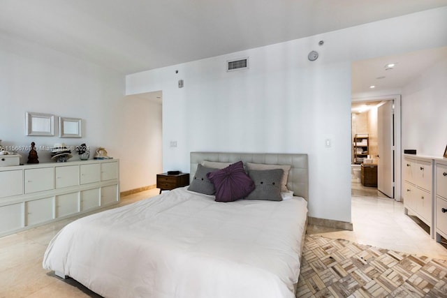 bedroom featuring light parquet flooring