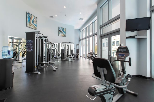 workout area featuring a high ceiling