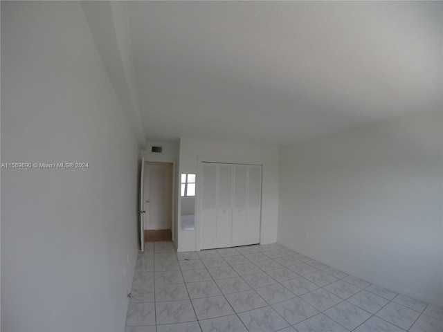 empty room with light tile flooring