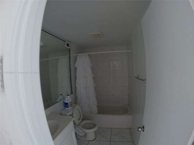 full bathroom featuring shower / bath combination with curtain, tile flooring, vanity, and toilet