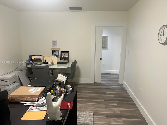 office space with dark hardwood / wood-style flooring