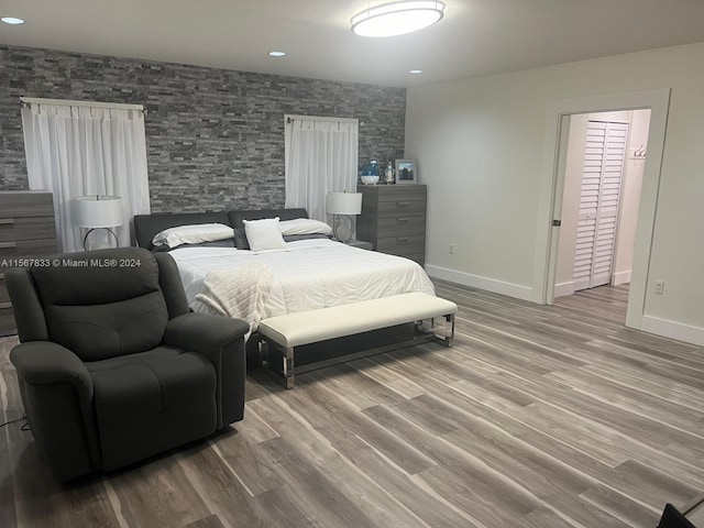 bedroom with hardwood / wood-style flooring