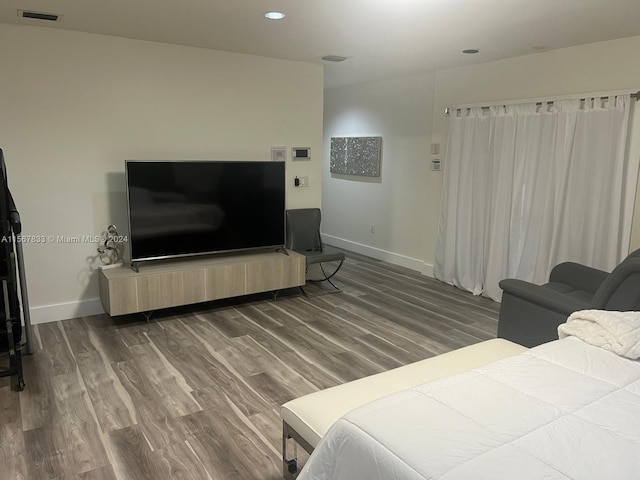 bedroom featuring dark hardwood / wood-style flooring