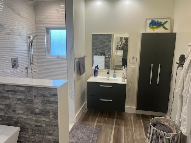 bathroom with hardwood / wood-style floors and oversized vanity