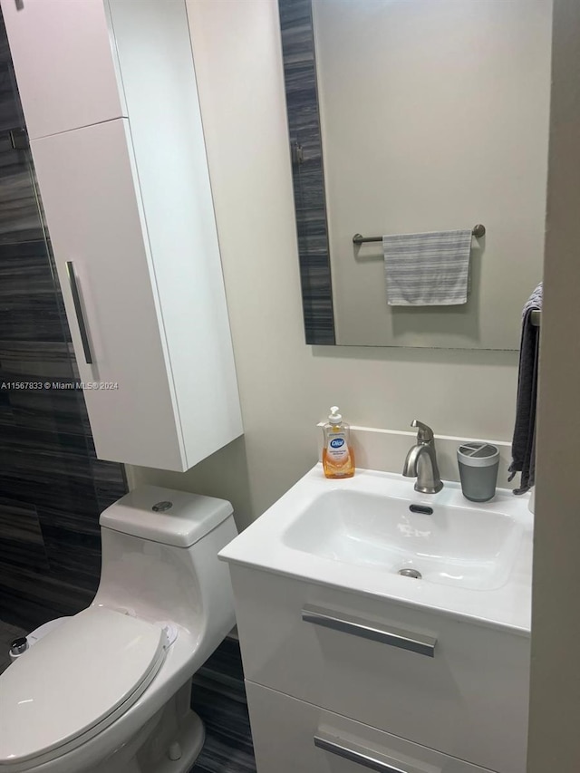 bathroom with vanity and toilet