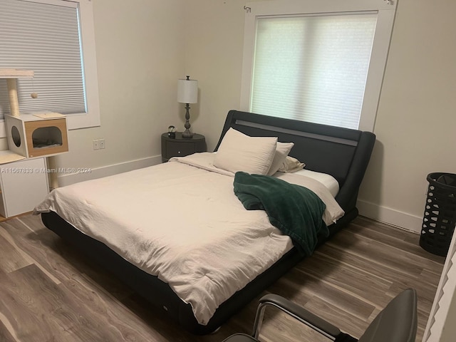 bedroom featuring dark hardwood / wood-style flooring