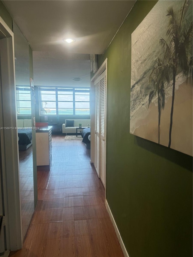 hallway with dark wood-type flooring