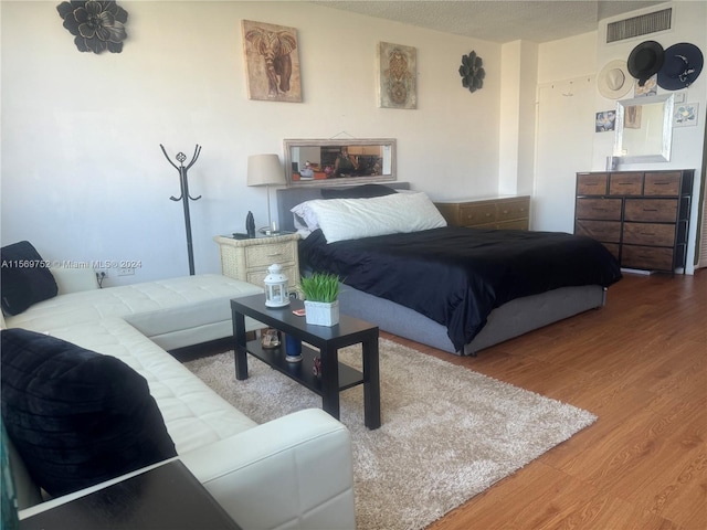 bedroom with light hardwood / wood-style flooring