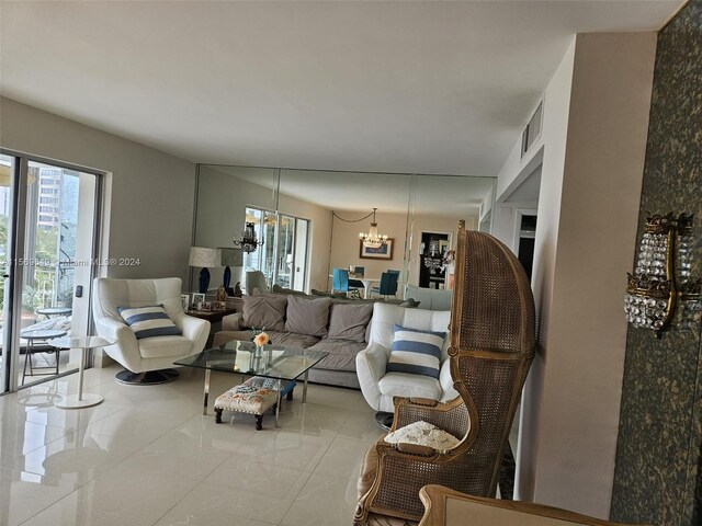 tiled living room featuring a chandelier