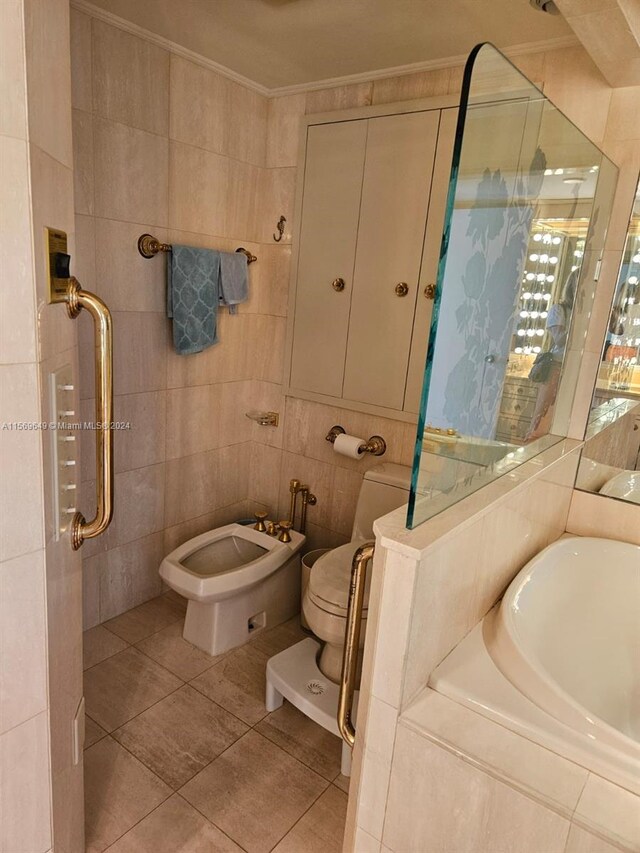 bathroom featuring tile patterned floors, tile walls, toilet, a bidet, and crown molding