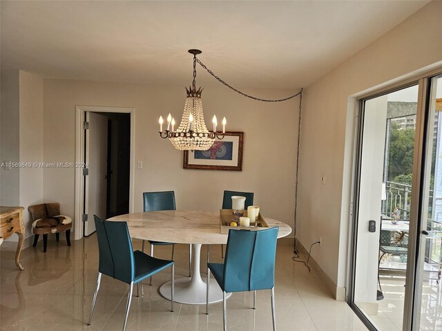 dining area featuring an inviting chandelier