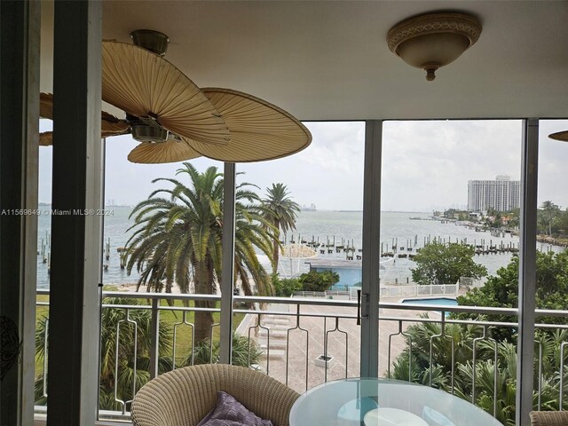 balcony featuring a water view