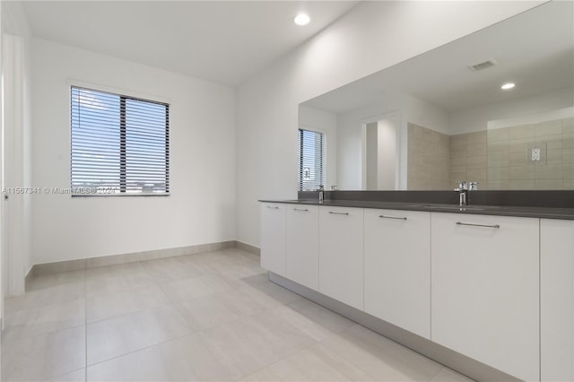 bathroom featuring vanity and tile patterned flooring