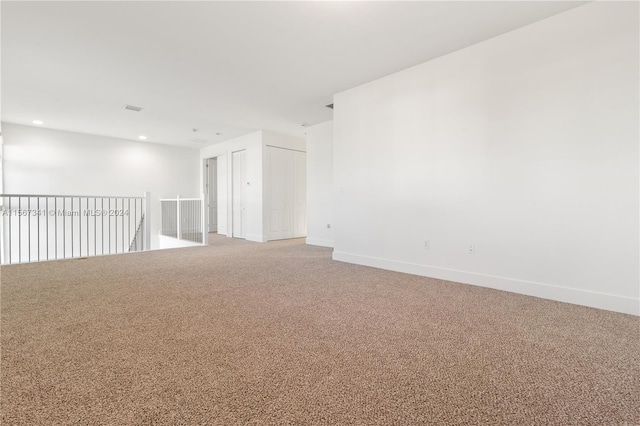 empty room with carpet flooring