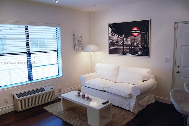 living room with dark hardwood / wood-style flooring